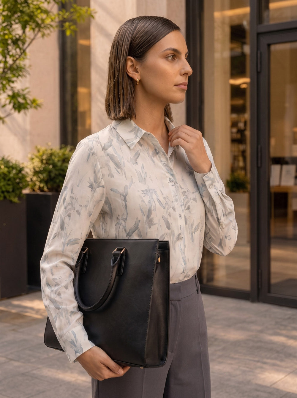 Side profile close-up of the abstract print collared shirt detailing the buttons and neckline