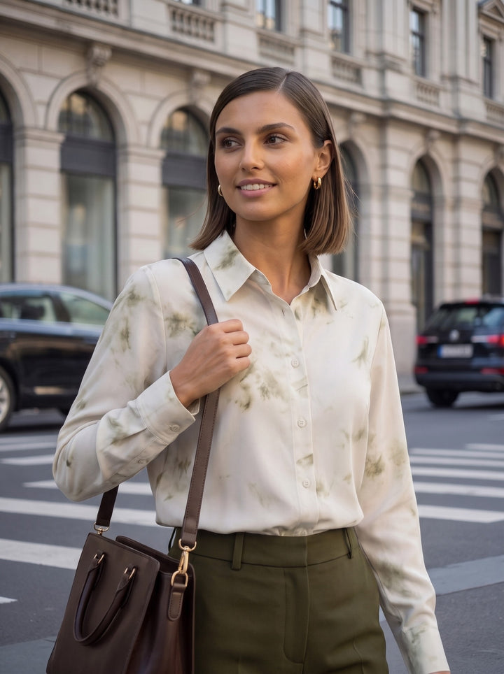 Close-up of an olive green watercolor long sleeve shirt with classic point collar